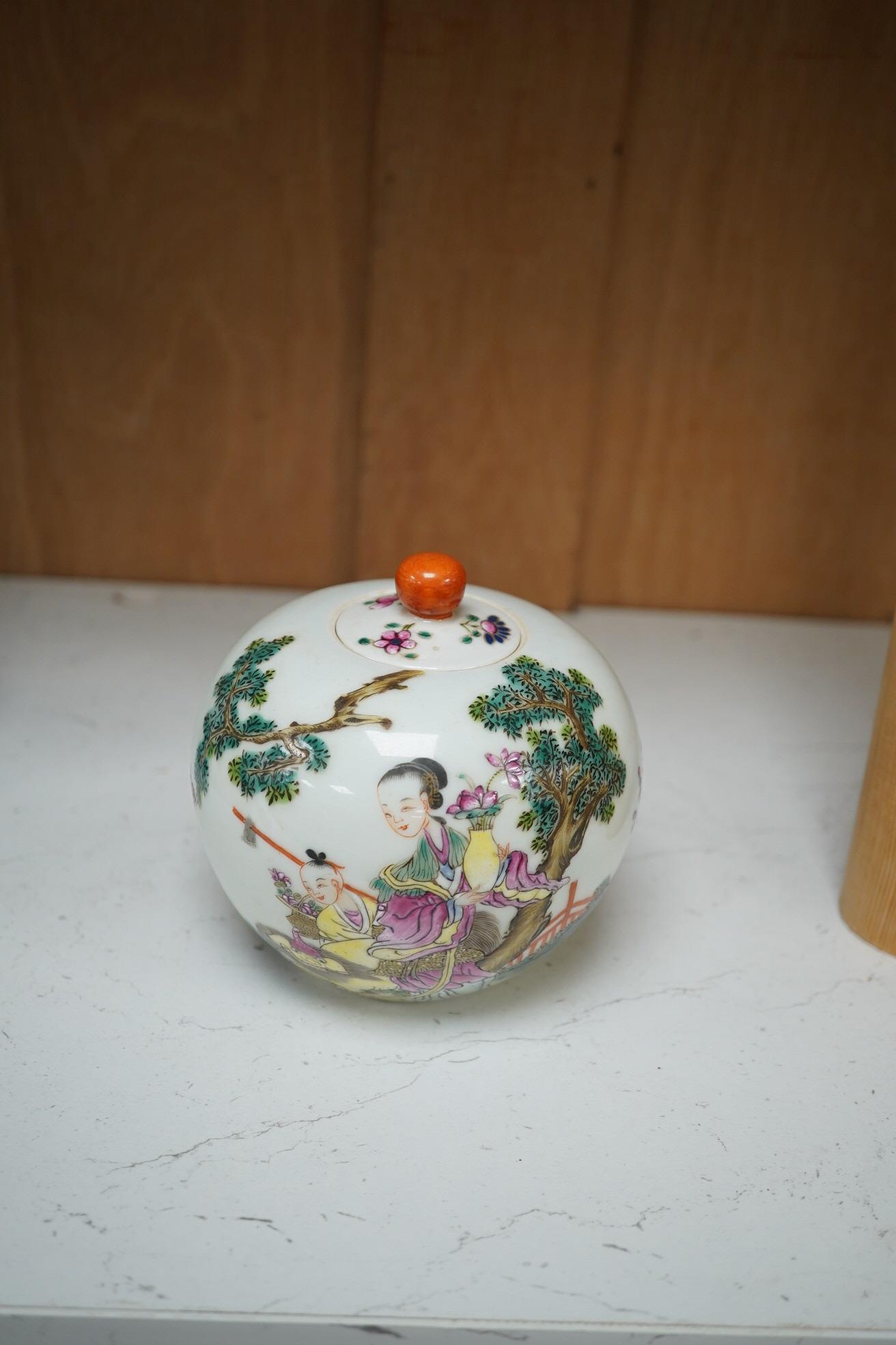 A famille rose bullet shape jar and cover, 10cm high. Condition - fair to good